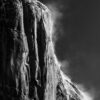 Black and white photo of snowdrifts blowing off of El Capitan in Yosemite National Park